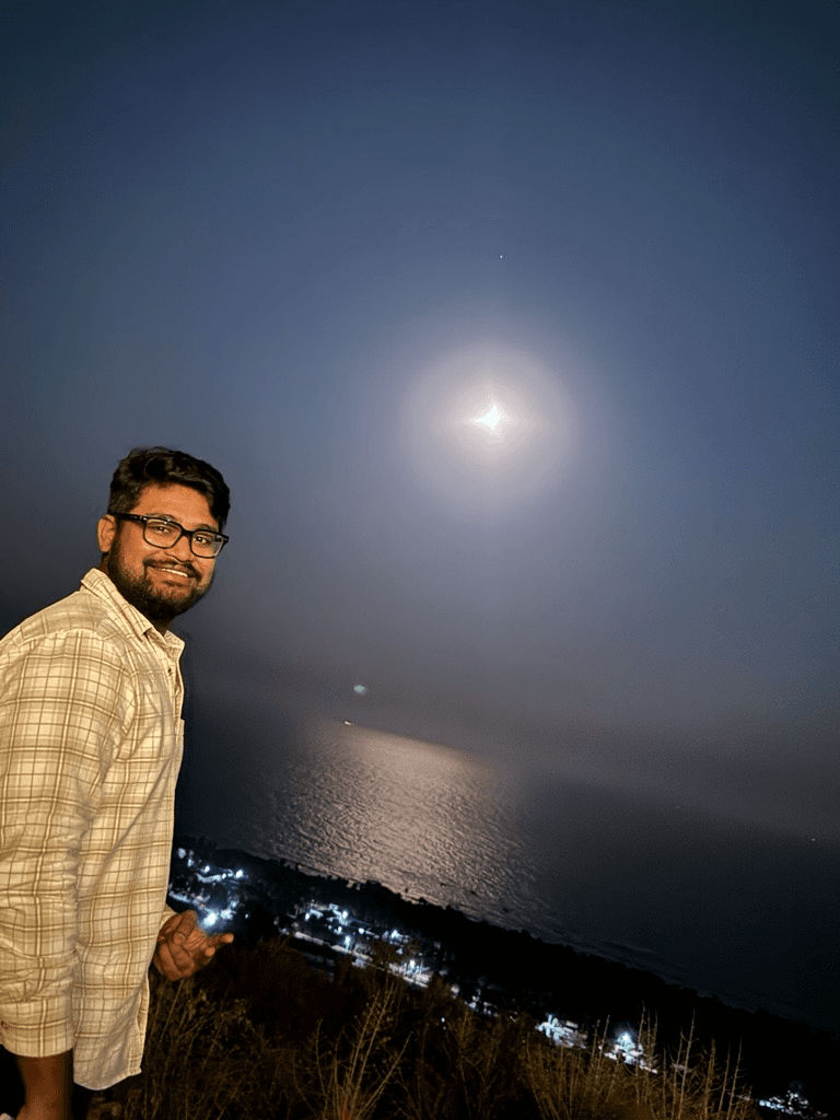 Darapu Tharakeswara Reddy — founder of JobyBots, photographed at moonlight on the coast